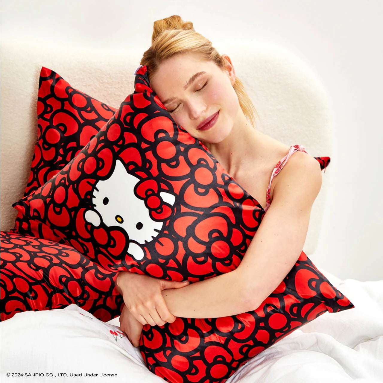 Hello Kitty x Kitsch Satin Pillowcase - Hello Kitty Bathes in a Sea of Bows Pillow by Kitsch as seen on celebrities