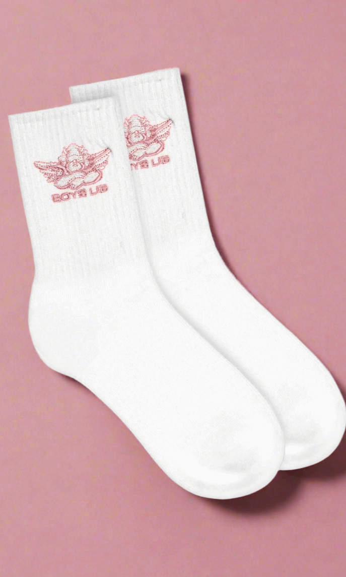 White socks with red logo on a pink background