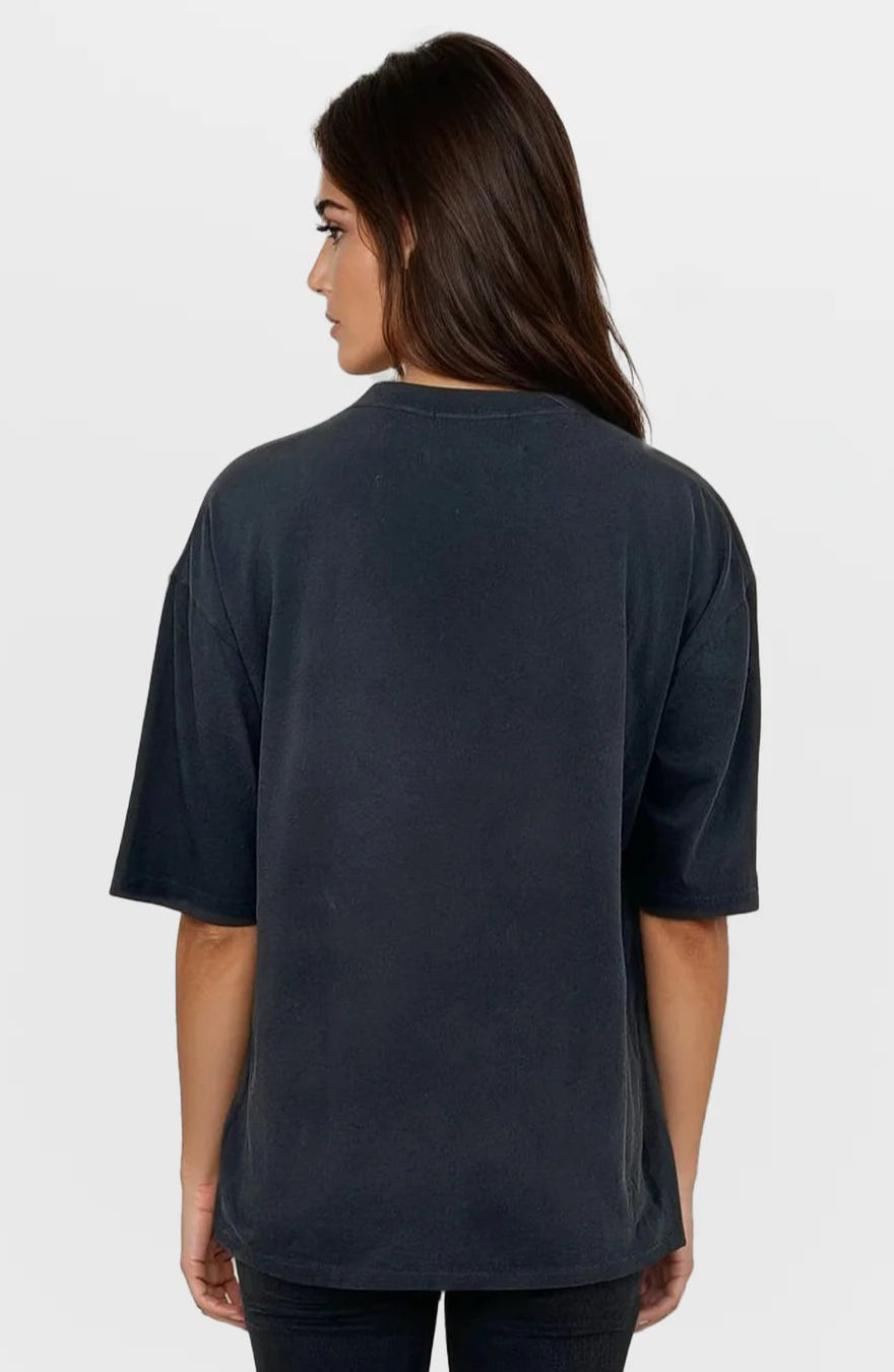 Person wearing a black t-shirt on a white background