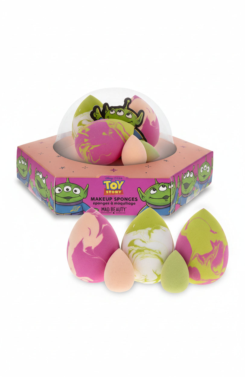 Makeup sponges with colorful designs in a 'Toy Story' themed box on a white background