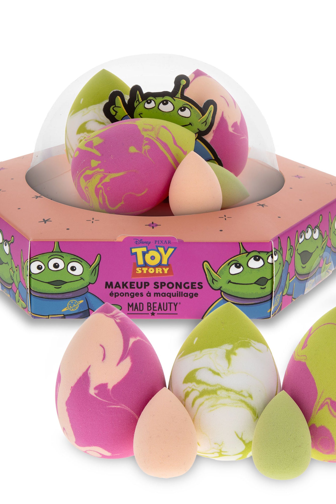 Makeup sponges with colorful designs in a 'Toy Story' themed box on a white background