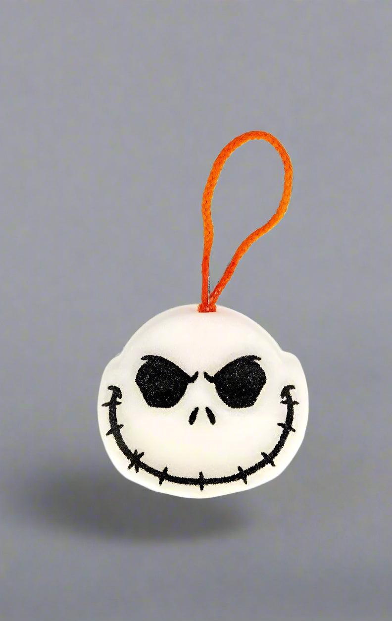 Plush keychain with a skull design on a white background