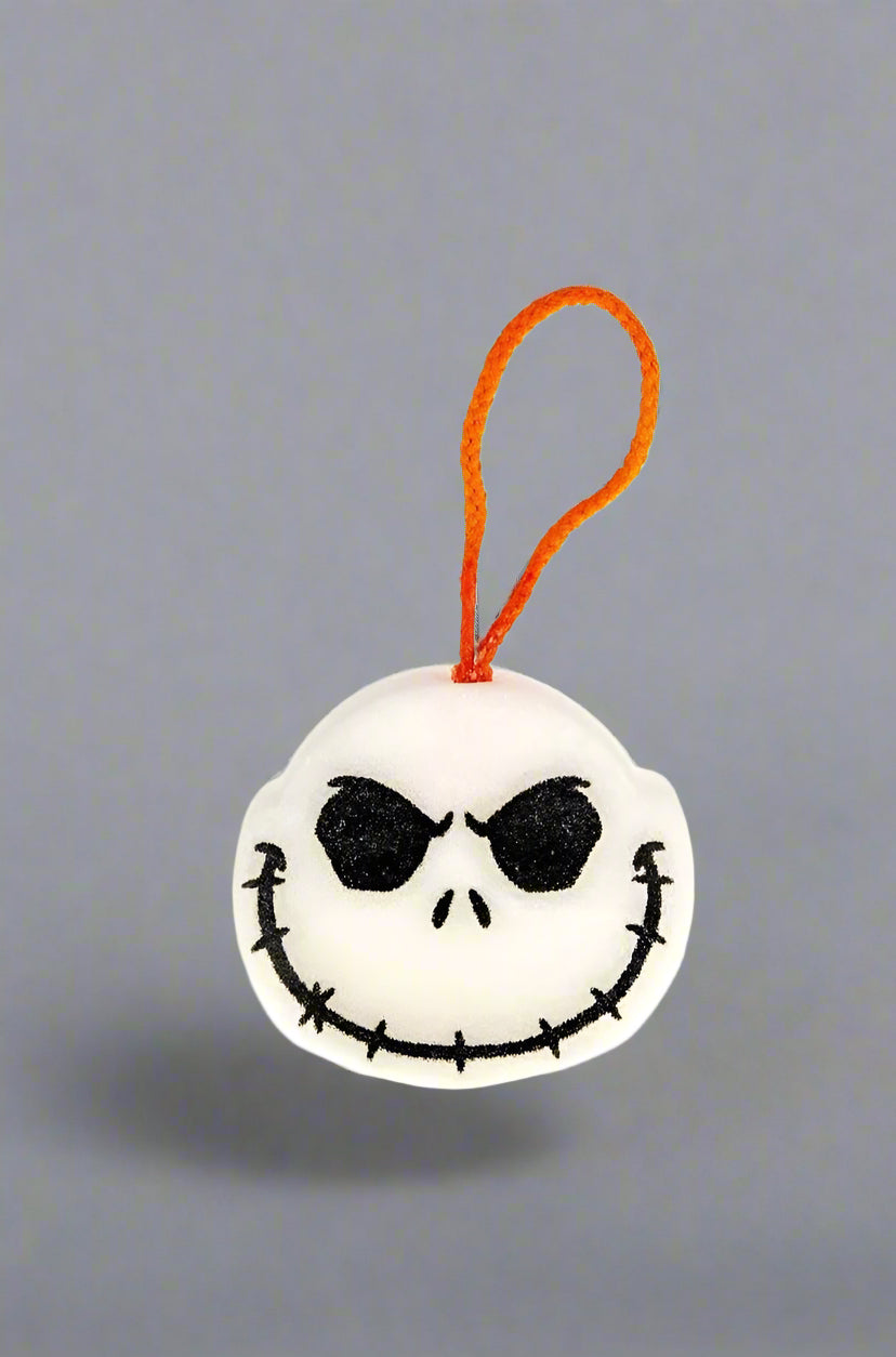 Plush keychain with a skull design on a white background