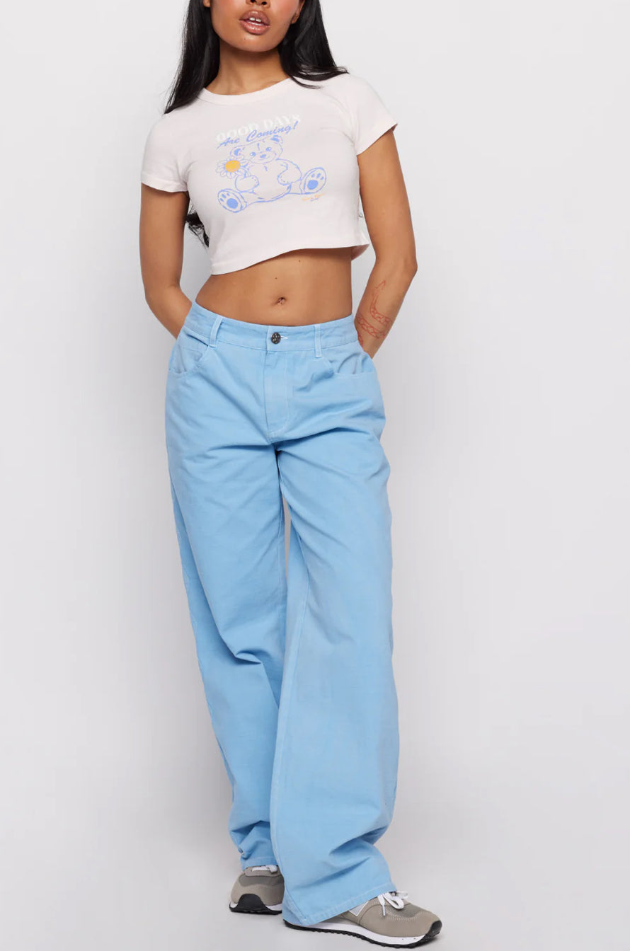 Samii Ryan x Smileyworld® Good Days Baby Tee T-Shirt by Samii Ryan as seen on celebrities