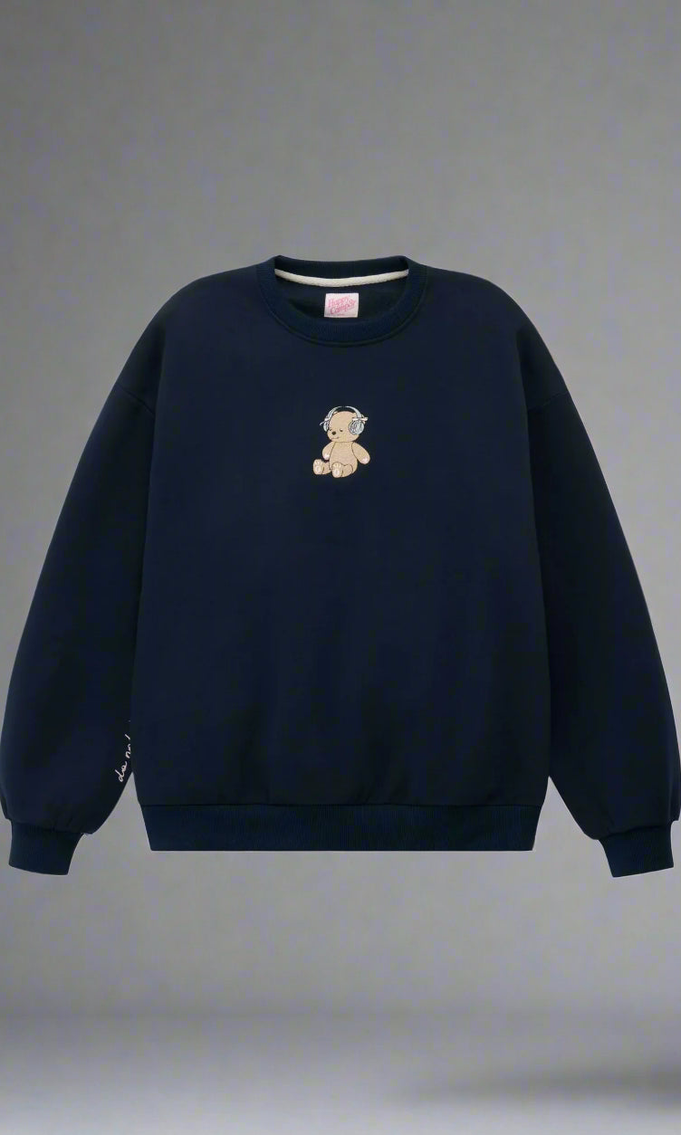 Navy blue sweatshirt with a teddy bear emblem on a light gray background