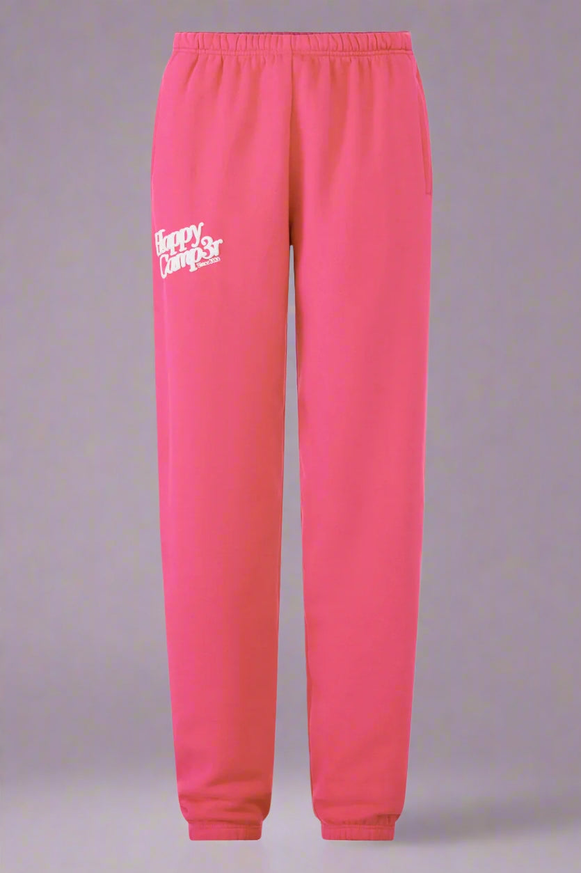 Pink sweatpants with a logo on a white background
