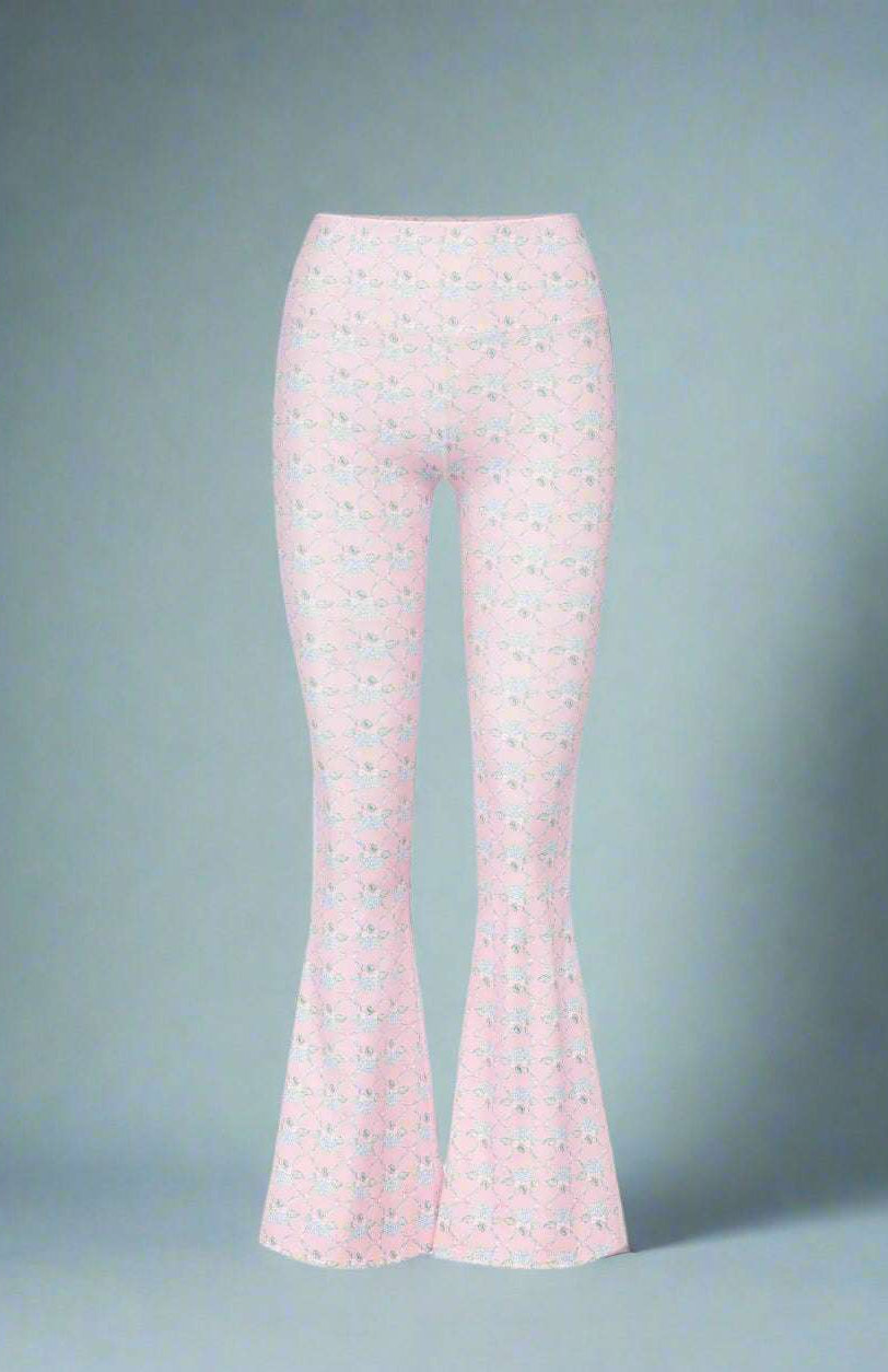 Flared pants with a subtle pattern on a white background