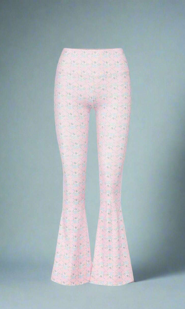 Flared pants with a subtle pattern on a white background