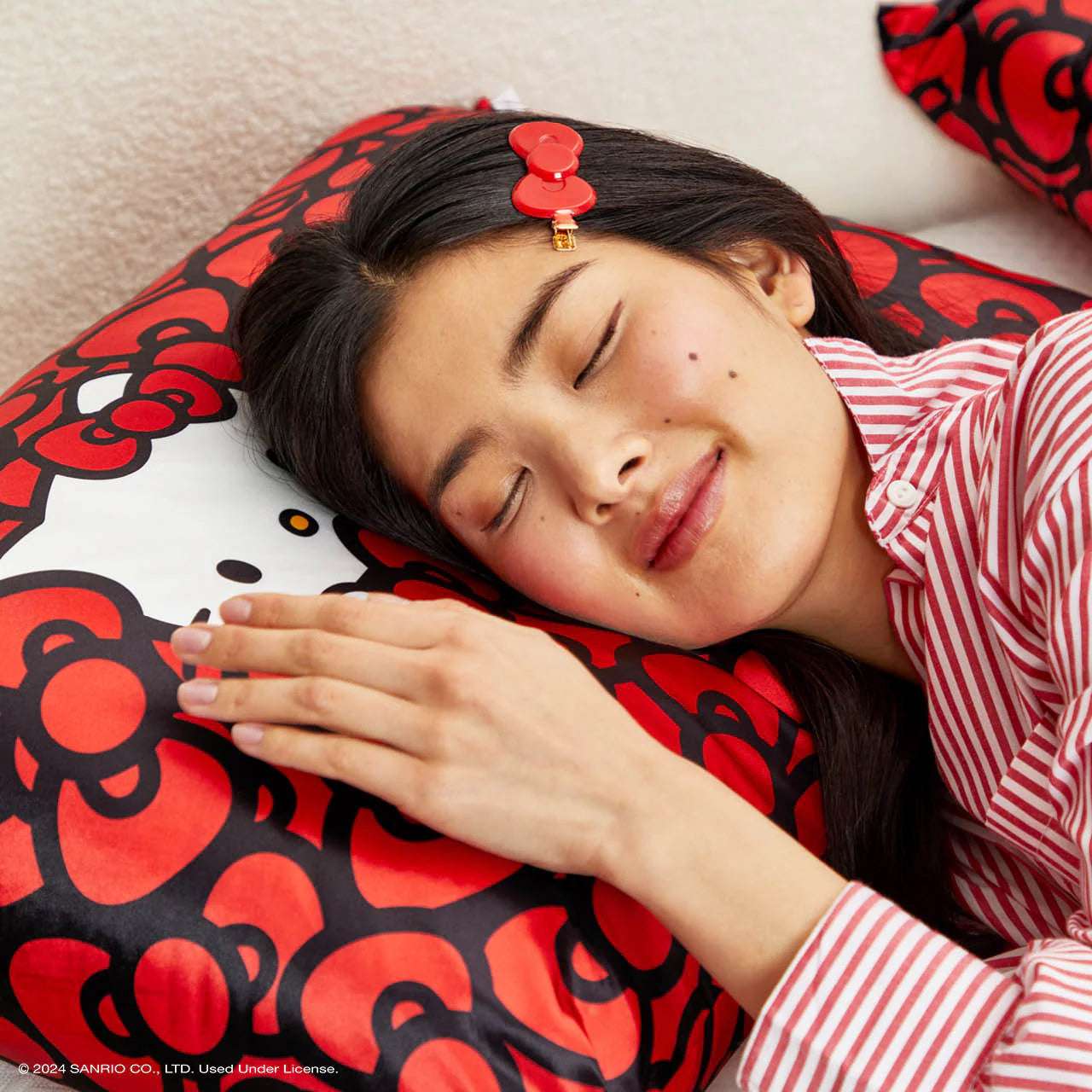 Hello Kitty x Kitsch Satin Pillowcase - Hello Kitty Bathes in a Sea of Bows Pillow by Kitsch as seen on celebrities