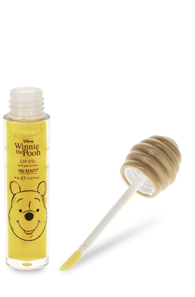 Winnie the Pooh lip oil with packaging on a white background