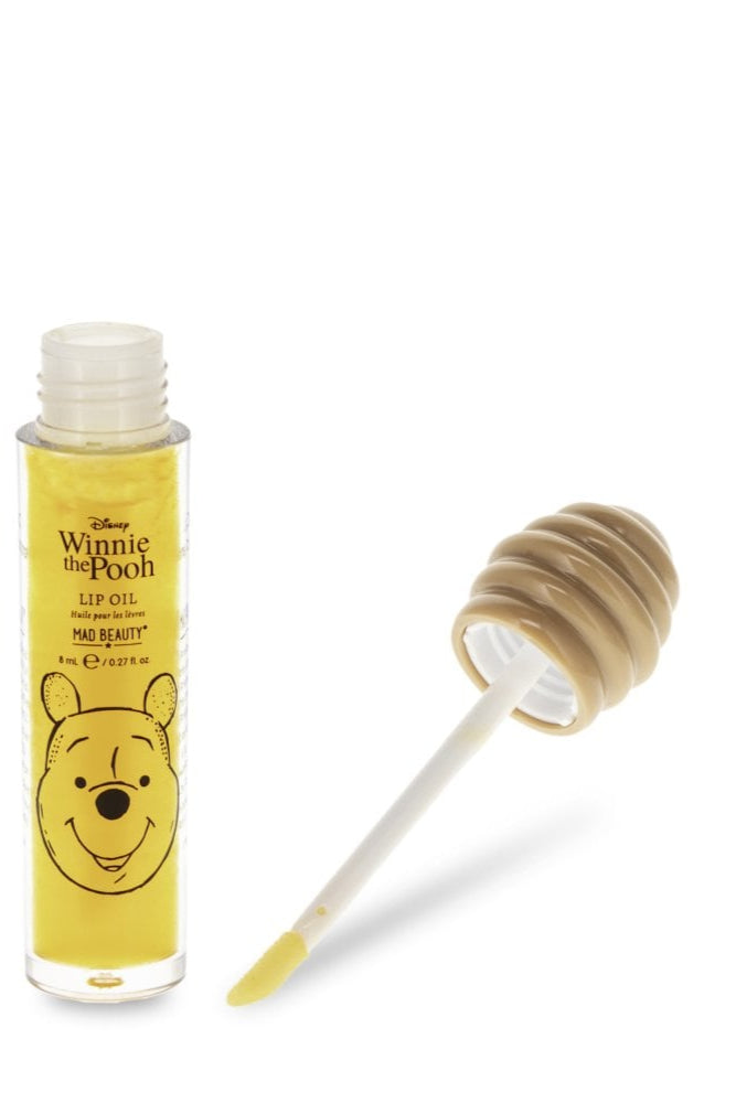 Winnie the Pooh lip oil with packaging on a white background