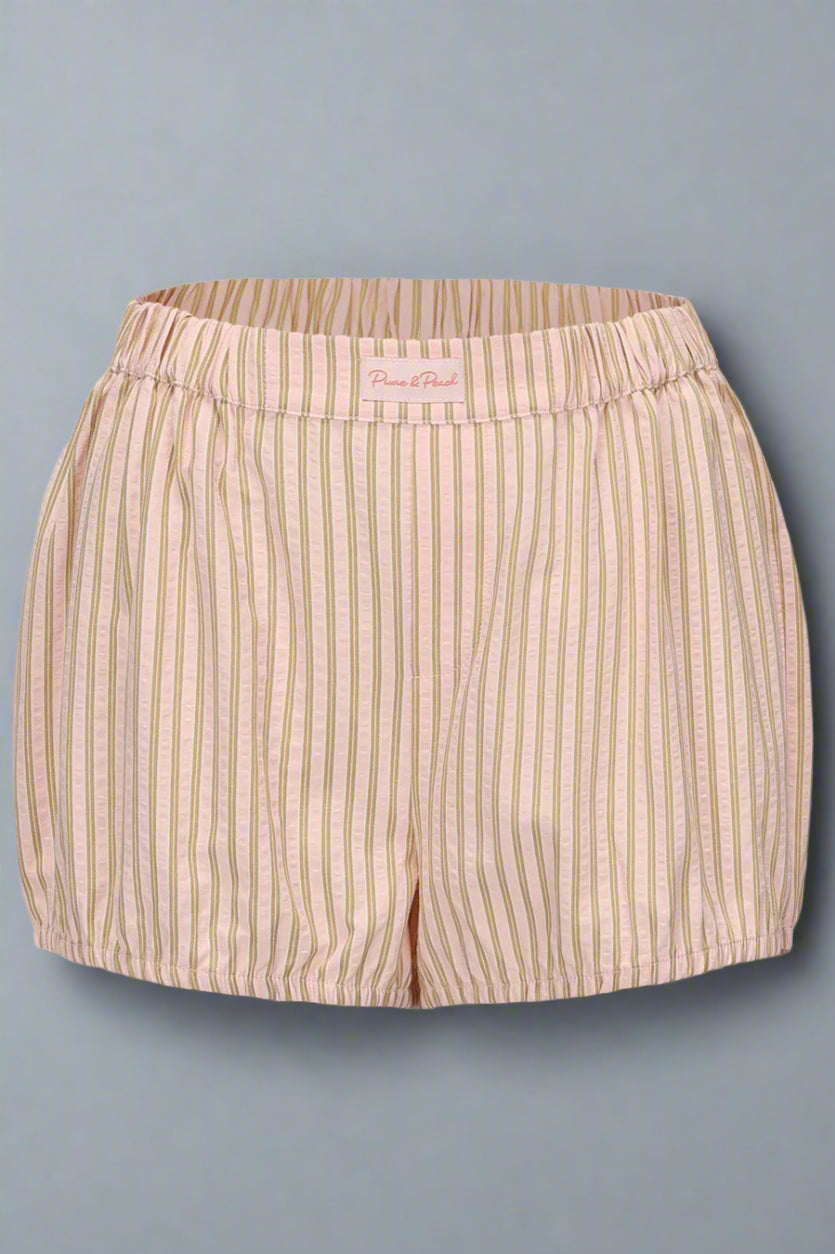 Beige striped shorts on a light gray background