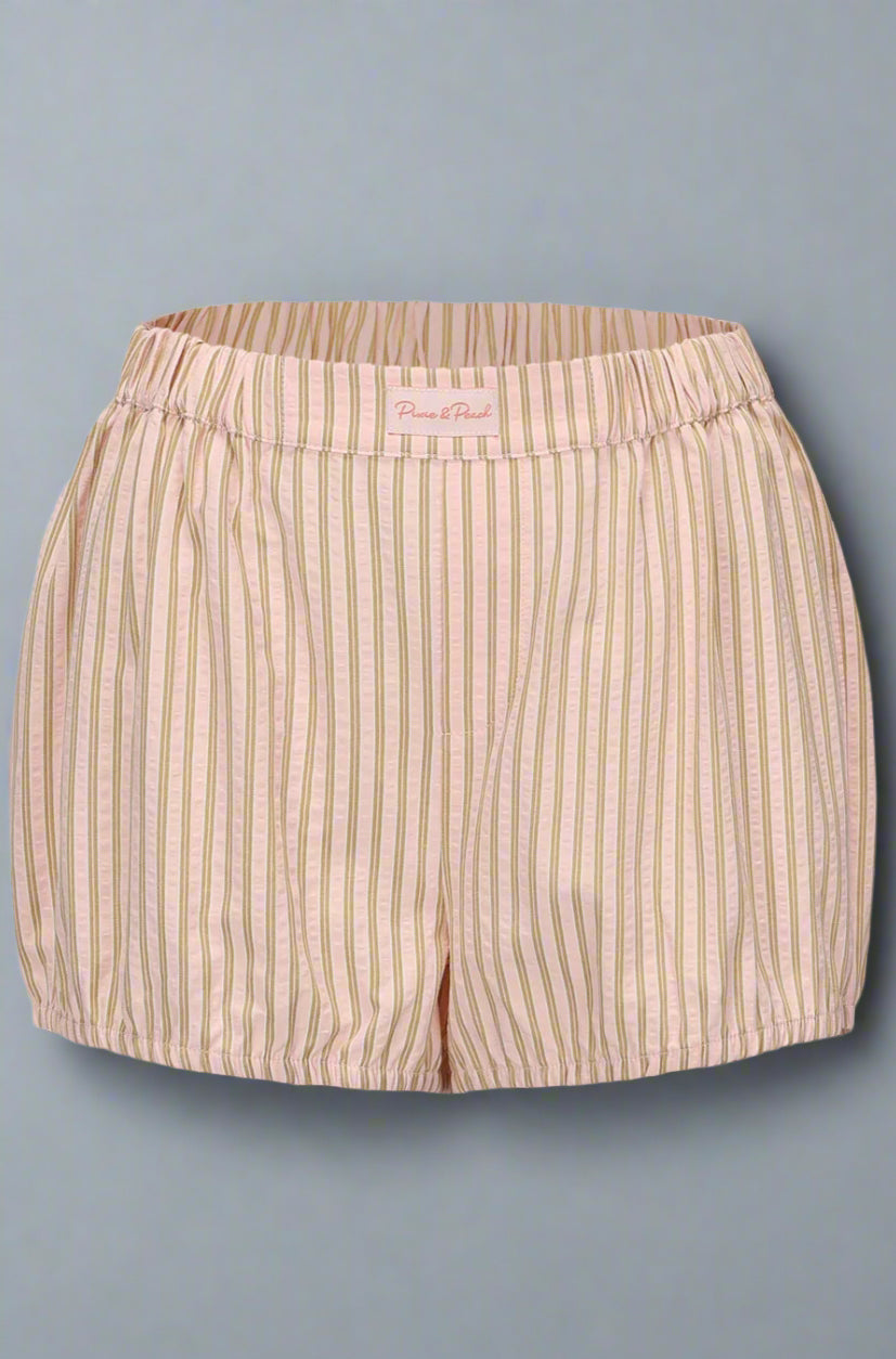 Beige striped shorts on a light gray background
