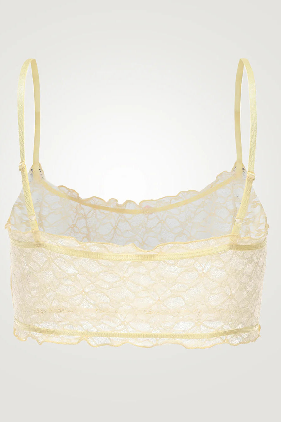 Yellow lace bralette on a light gray background