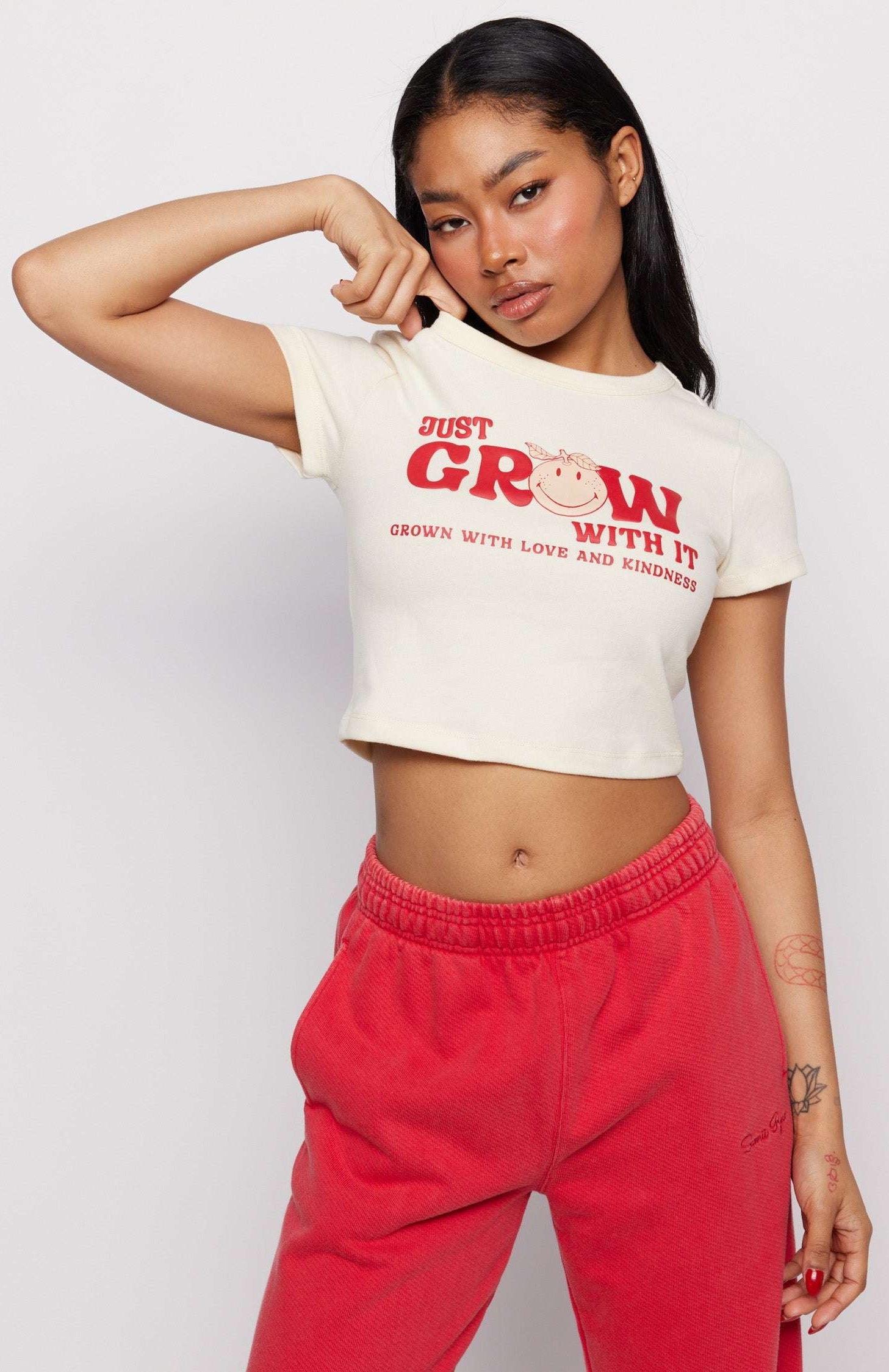 Samii Ryan x Smileyworld® Just Grow With It Baby Tee T-Shirt by Samii Ryan as seen on celebrities