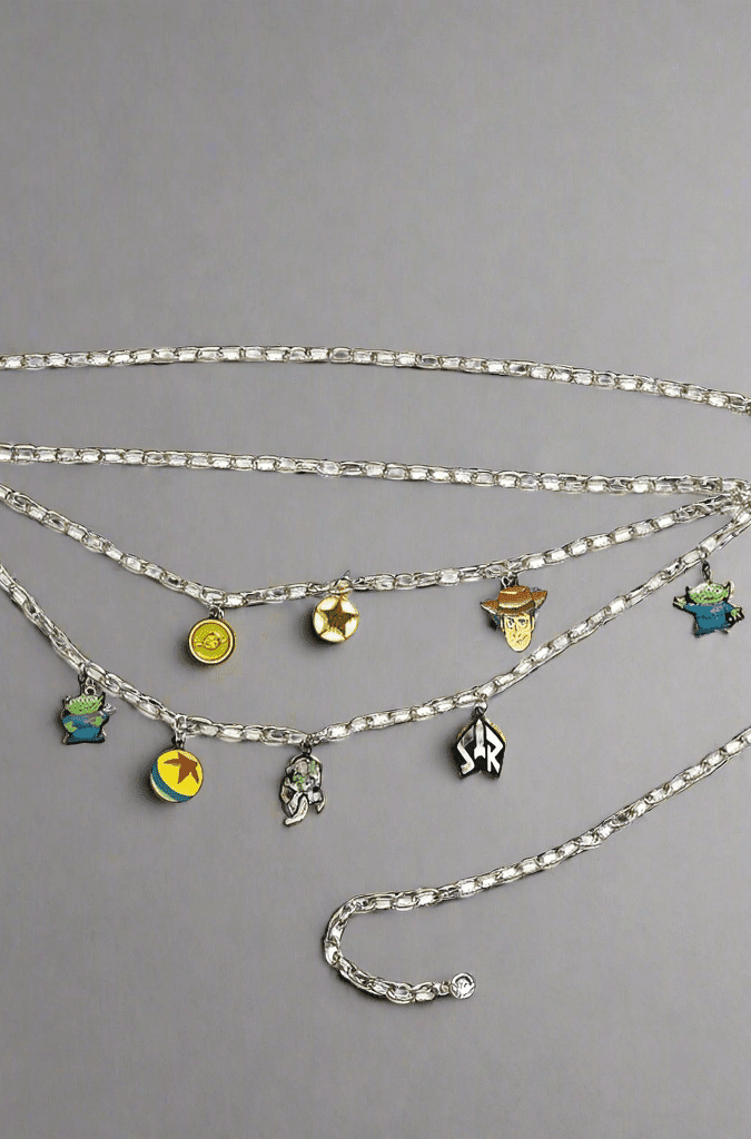 Shop Buckle Down Products Buckle Down Products Disney Toy Story Charm Chain Belt Belt for women – premium loungewear and festival fashion at Spoiled Brat