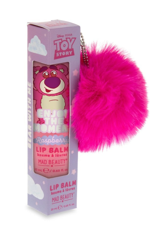 Lip balm with pink fuzzy keychain and 'Toy Story' packaging on a white background