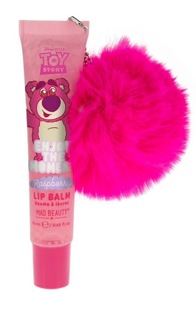Pink lip balm with a fluffy pink accessory on a white background