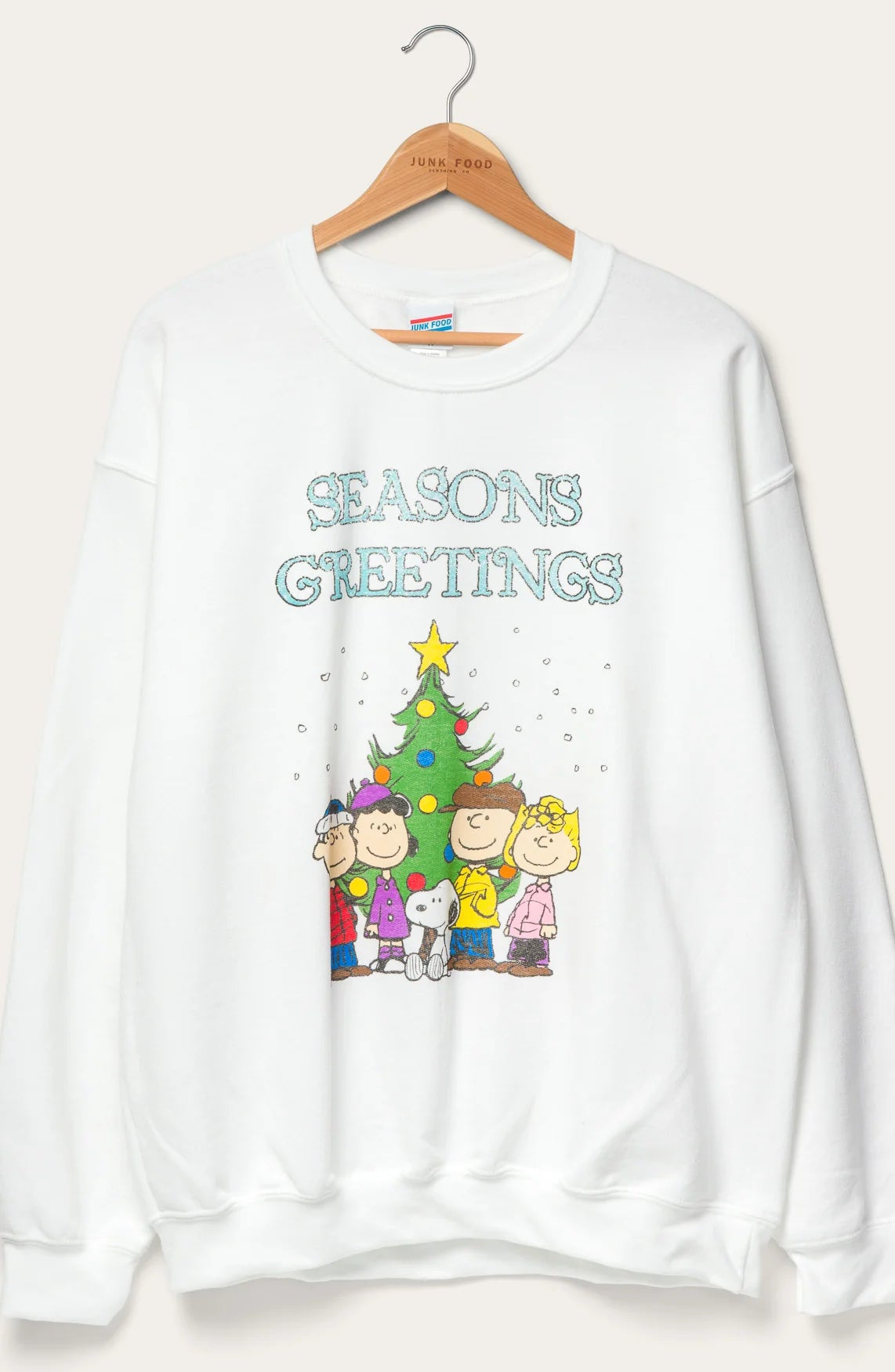 Shop Junk Food JUNKFOOD Peanuts Seasons Greetings Christmas Jumper Jumper for women – premium loungewear and festival fashion at Spoiled Brat
