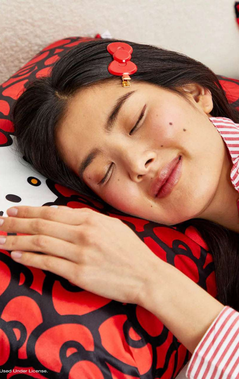 Shop Kitsch Hello Kitty x Kitsch Satin Pillowcase - Hello Kitty Bathes in a Sea of Bows Pillow for women – premium loungewear and festival fashion at Spoiled Brat