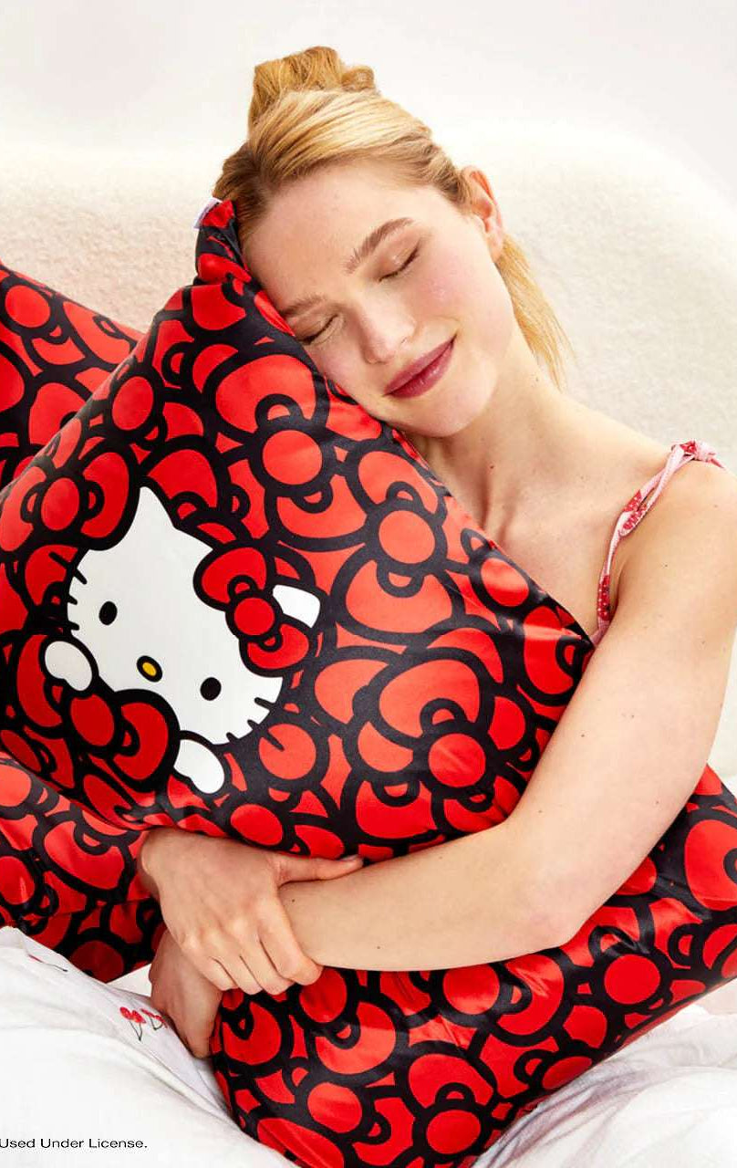 Shop Kitsch Hello Kitty x Kitsch Satin Pillowcase - Hello Kitty Bathes in a Sea of Bows Pillow for women – premium loungewear and festival fashion at Spoiled Brat