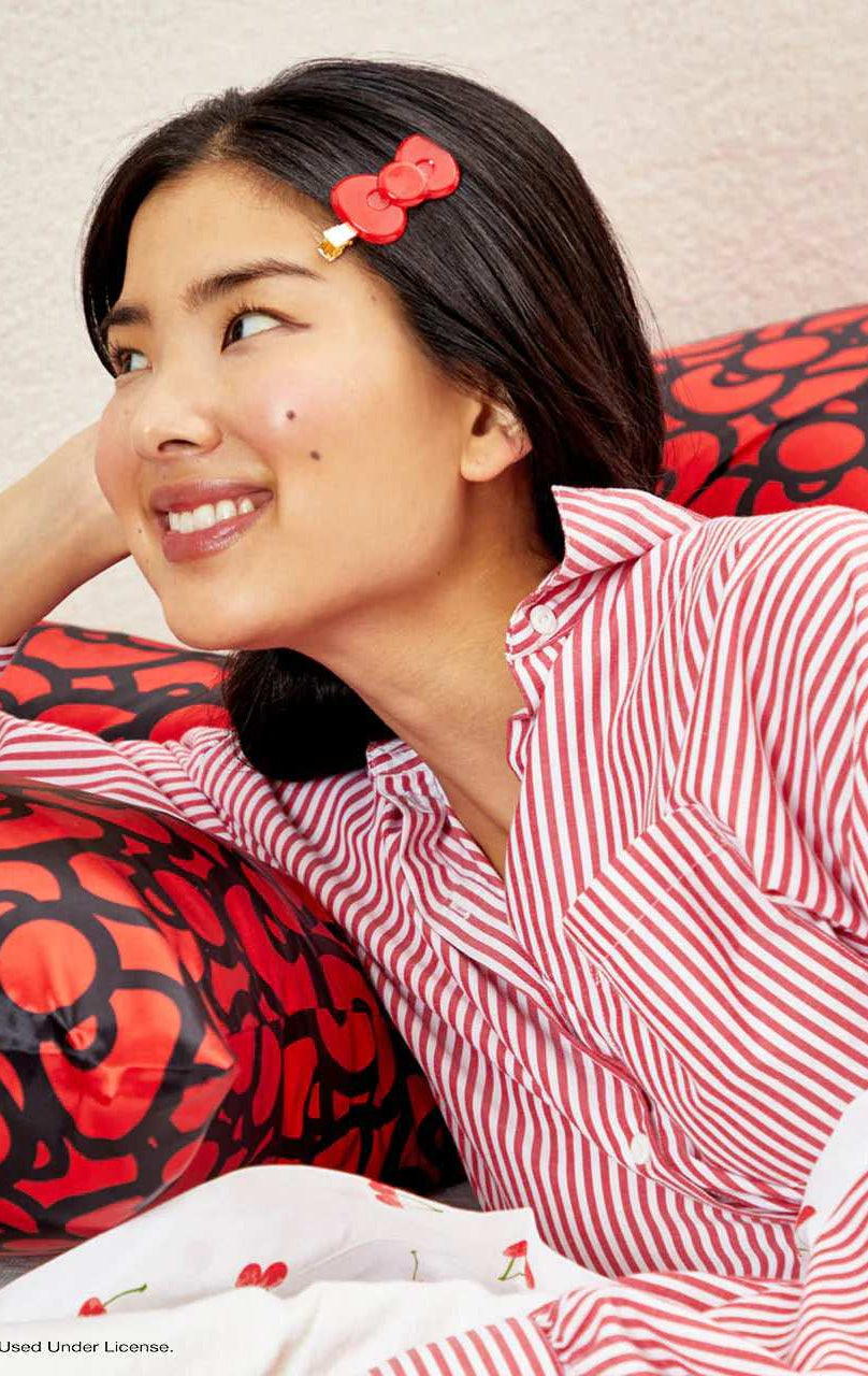 Shop Kitsch Hello Kitty x Kitsch Satin Pillowcase - Hello Kitty Bathes in a Sea of Bows Pillow for women – premium loungewear and festival fashion at Spoiled Brat