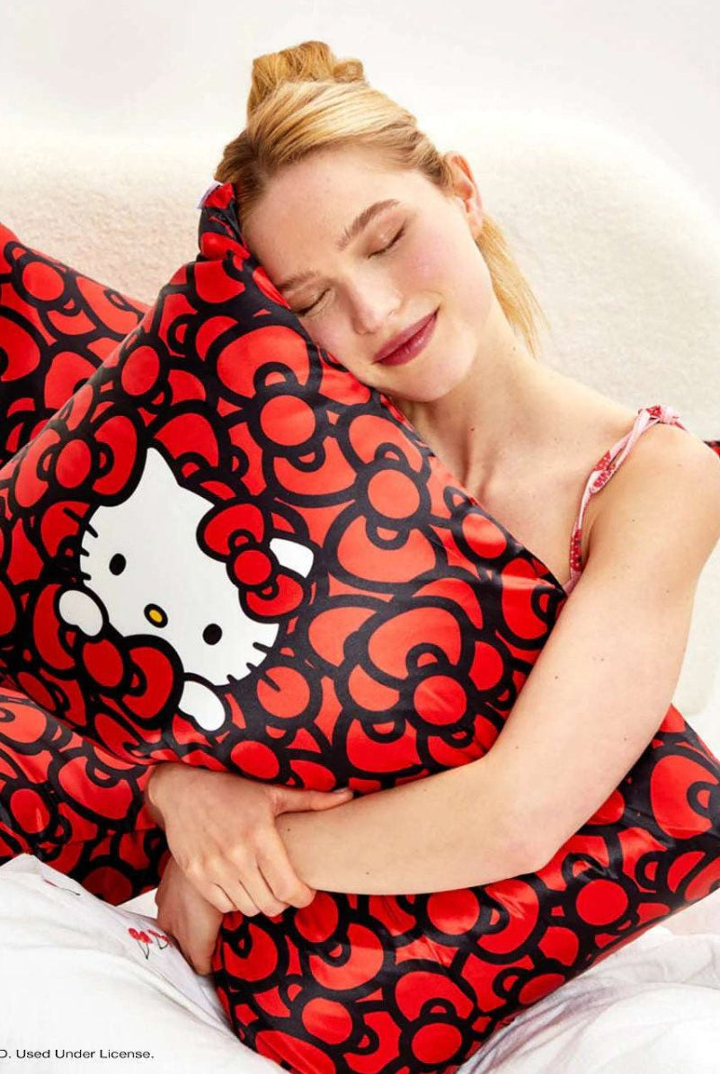 Shop Kitsch Hello Kitty x Kitsch Satin Pillowcase - Hello Kitty Bathes in a Sea of Bows Pillow for women – premium loungewear and festival fashion at Spoiled Brat