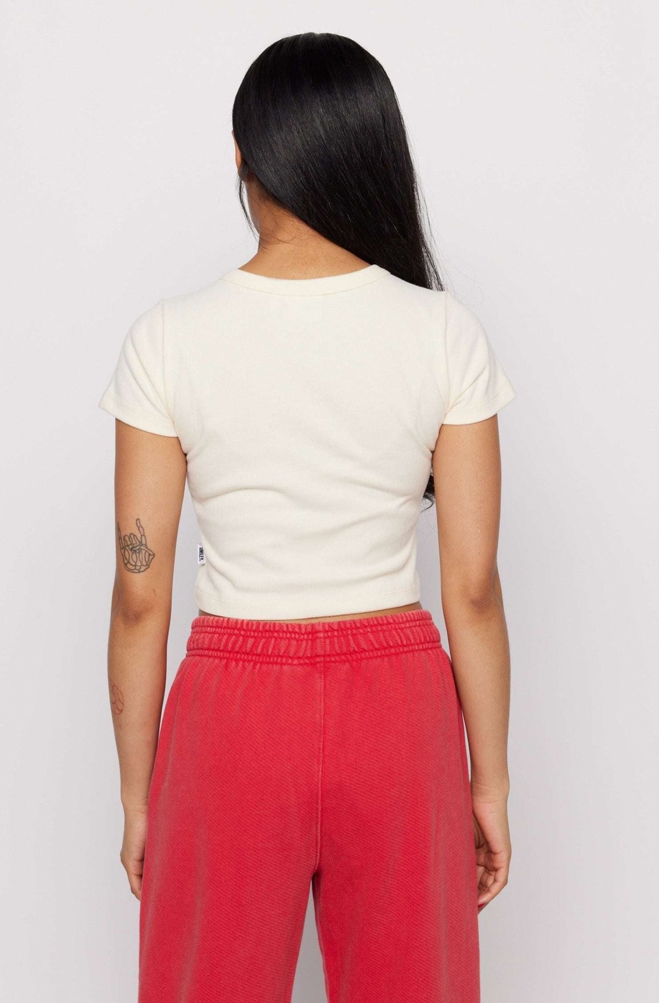 Shop Samii Ryan Samii Ryan x Smileyworld® Just Grow With It Baby Tee T-Shirt for women – premium loungewear and festival fashion at Spoiled Brat