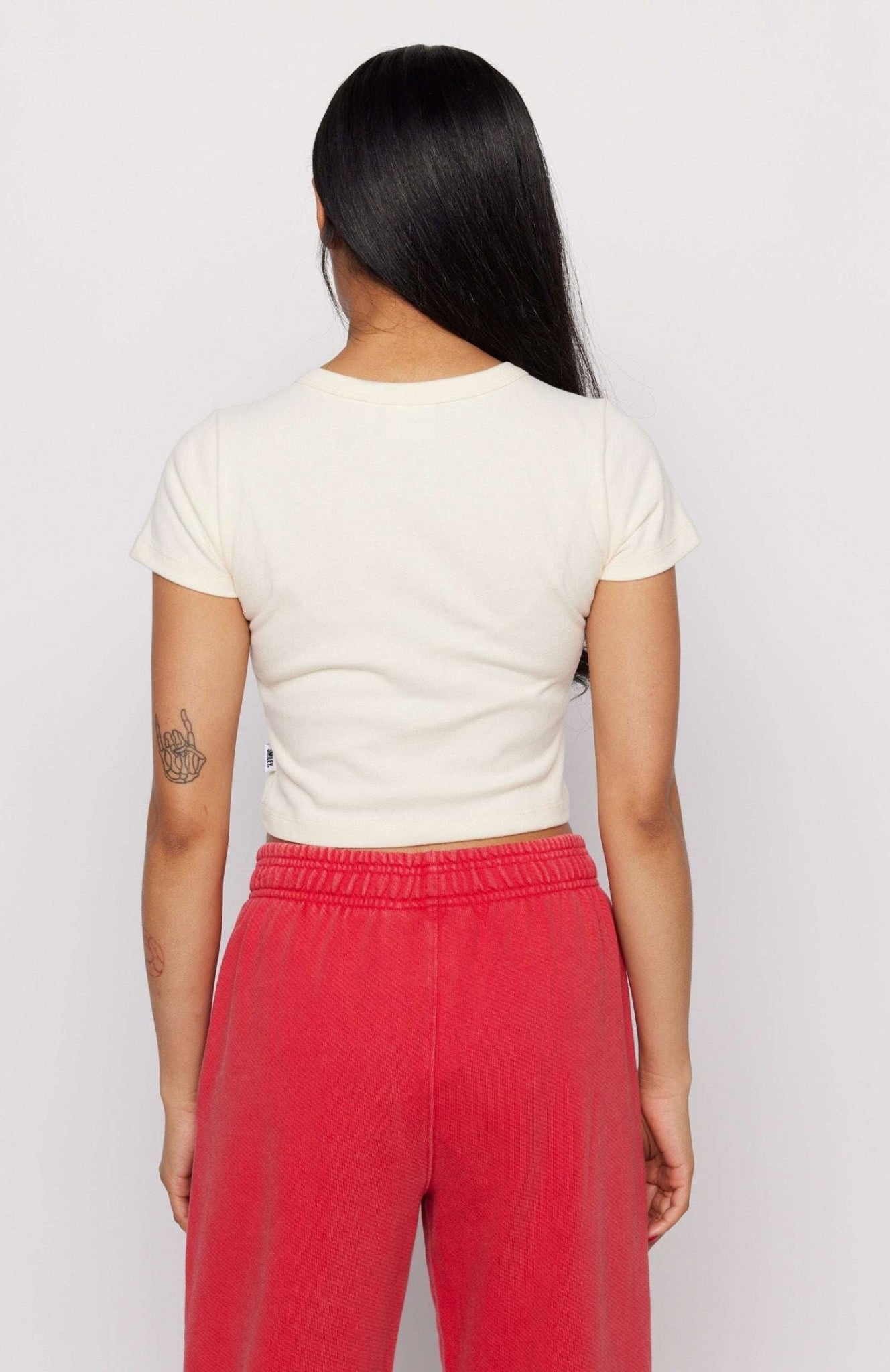 Shop Samii Ryan Samii Ryan x Smileyworld® Just Grow With It Baby Tee T-Shirt for women – premium loungewear and festival fashion at Spoiled Brat