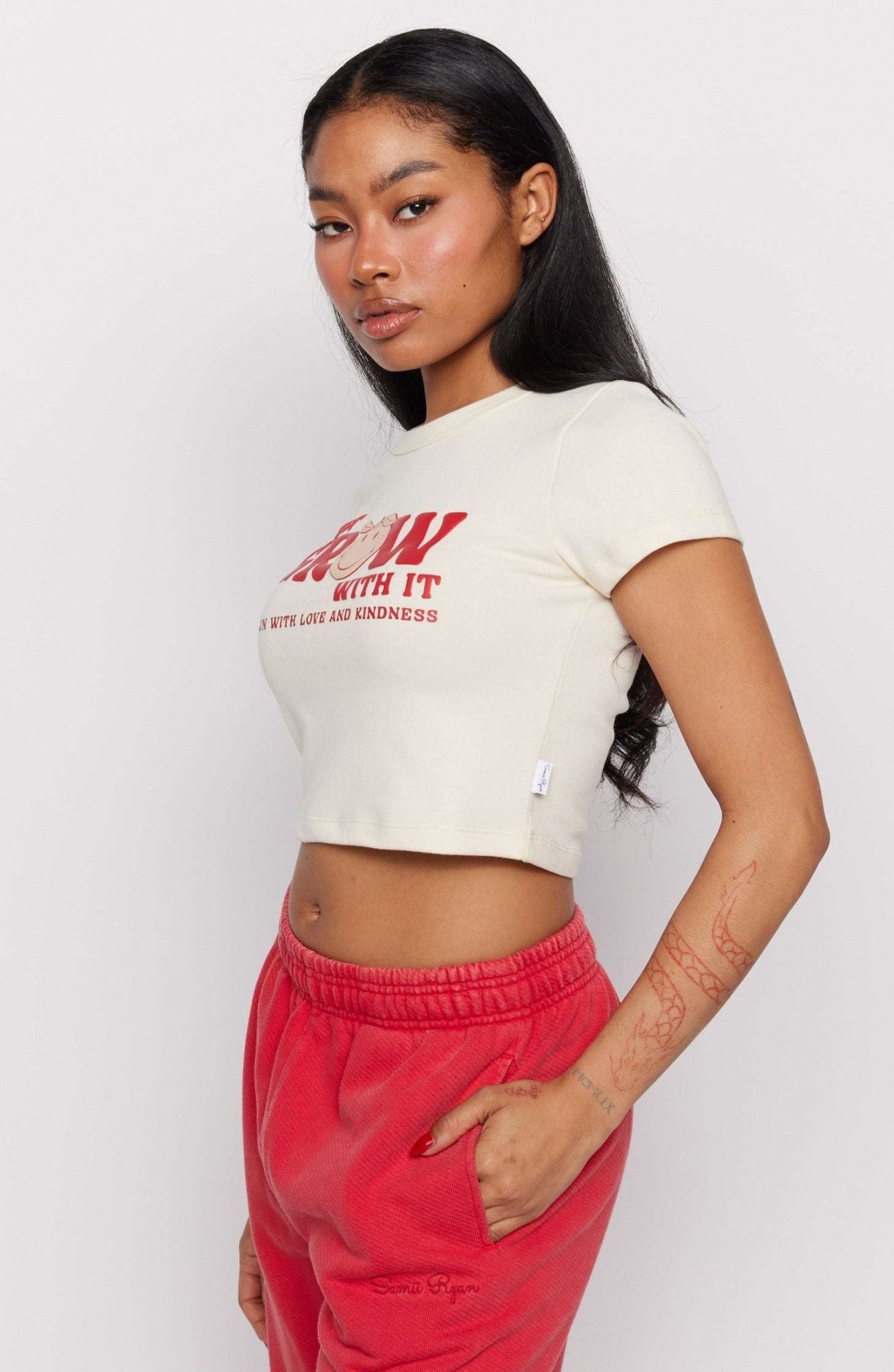 Shop Samii Ryan Samii Ryan x Smileyworld® Just Grow With It Baby Tee T-Shirt for women – premium loungewear and festival fashion at Spoiled Brat