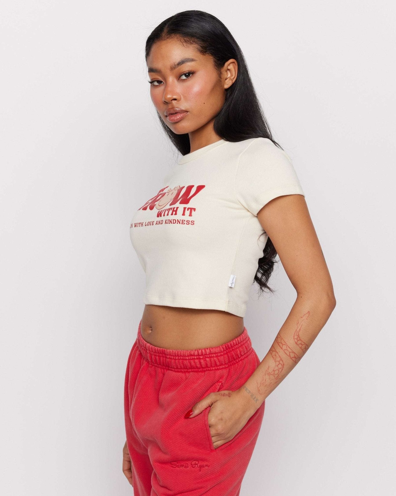 Shop Samii Ryan Samii Ryan x Smileyworld® Just Grow With It Baby Tee T-Shirt for women – premium loungewear and festival fashion at Spoiled Brat