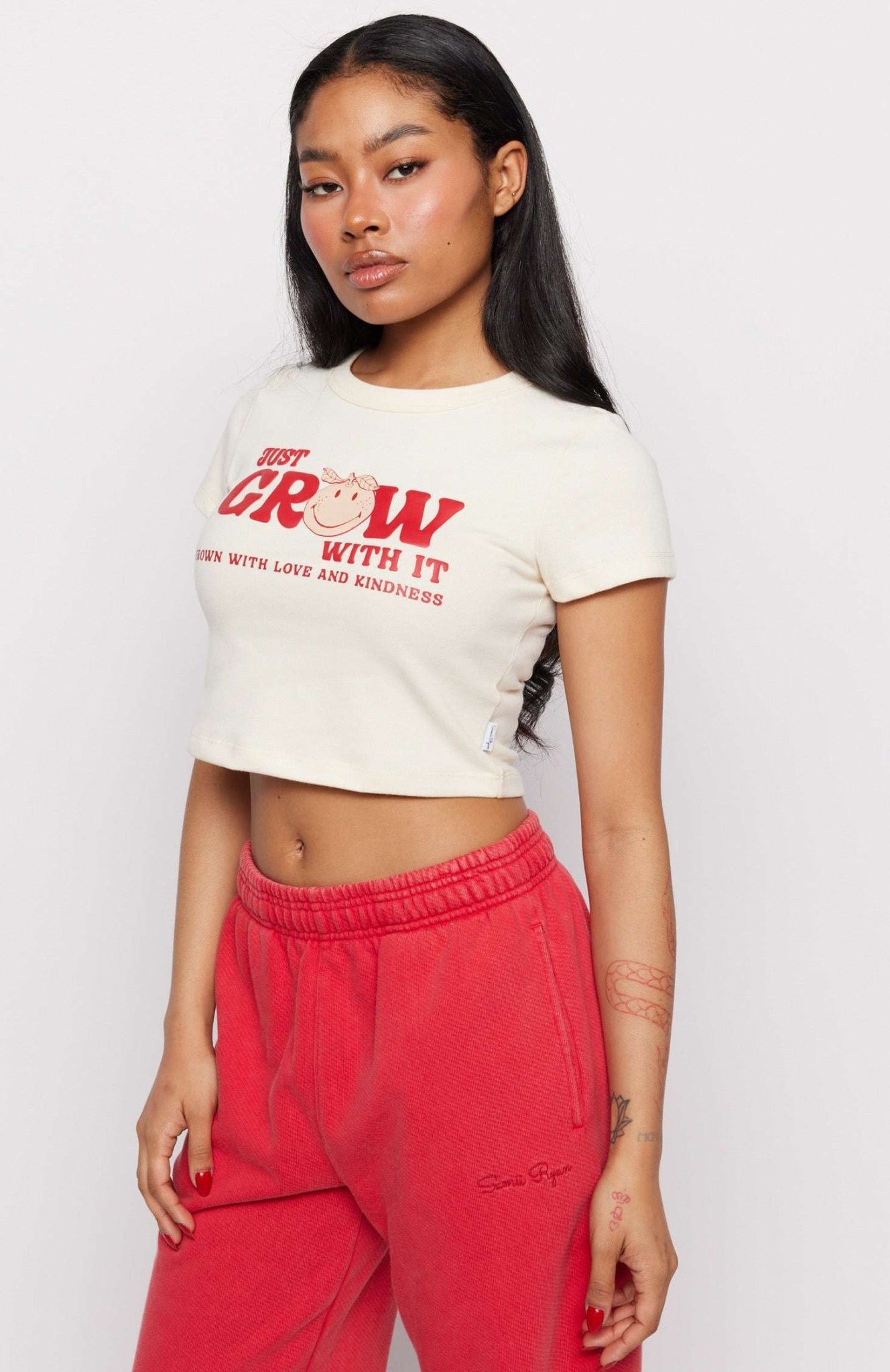 Shop Samii Ryan Samii Ryan x Smileyworld® Just Grow With It Baby Tee T-Shirt for women – premium loungewear and festival fashion at Spoiled Brat