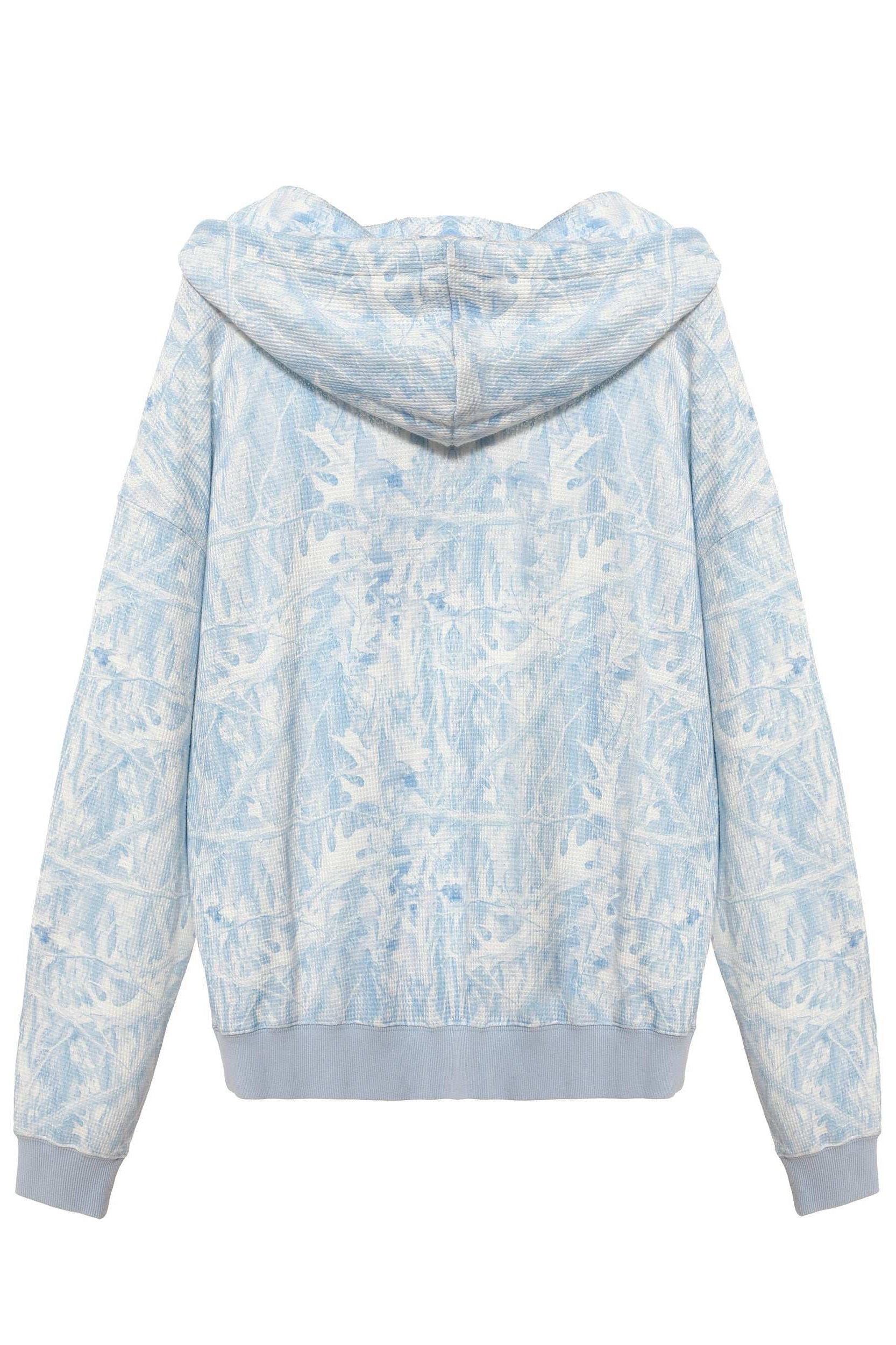 Light blue and white floral patterned hoodie on a white background