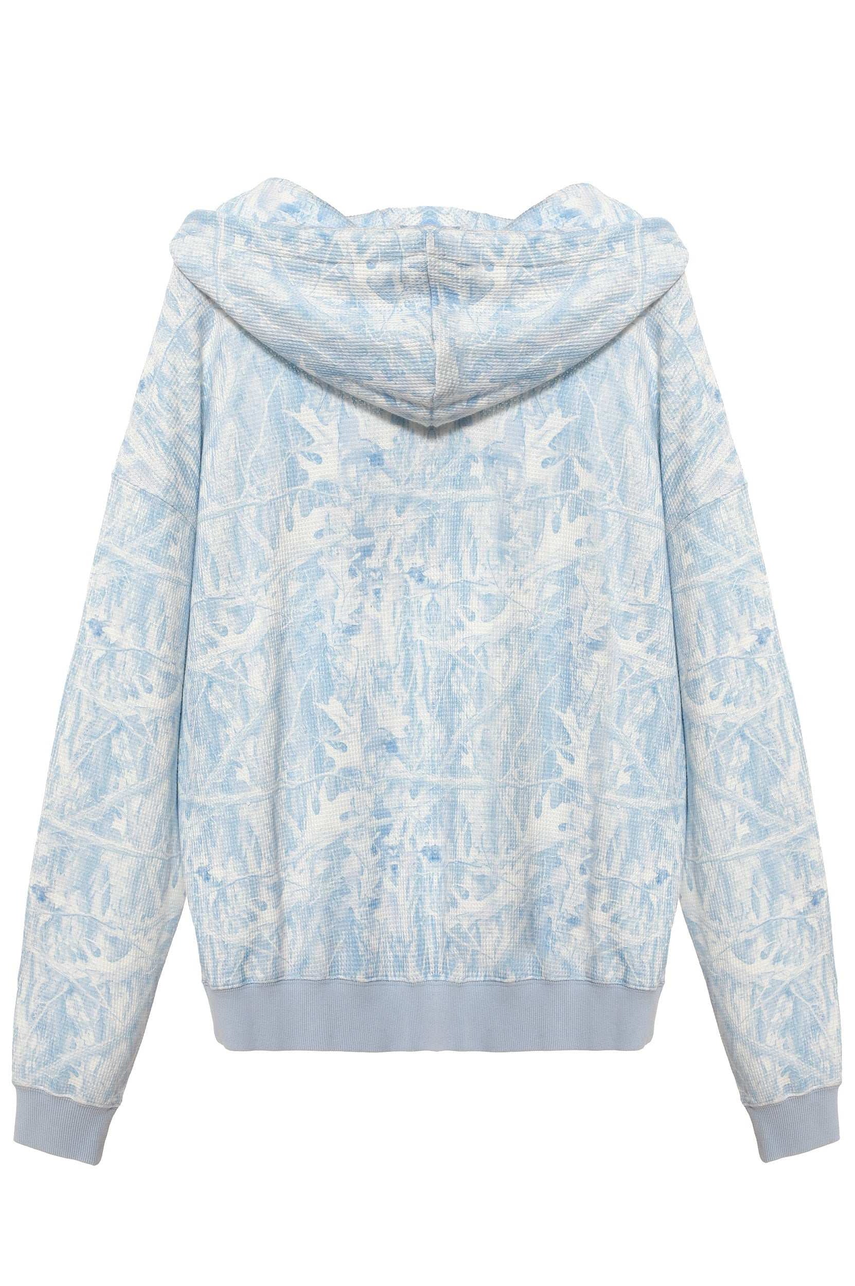 Light blue and white floral patterned hoodie on a white background