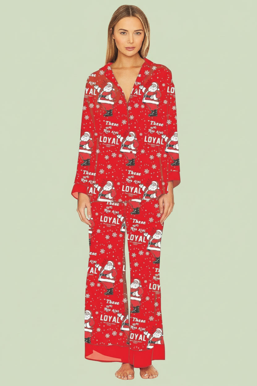 Woman wearing a red pajama set with festive pattern on a white background