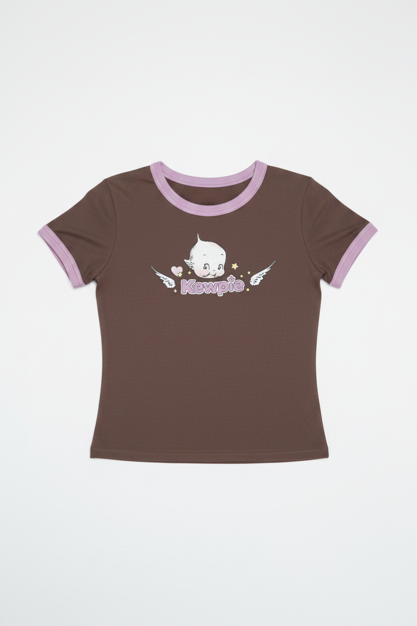 Woman wearing a brown t-shirt with a graphic design on a plain background