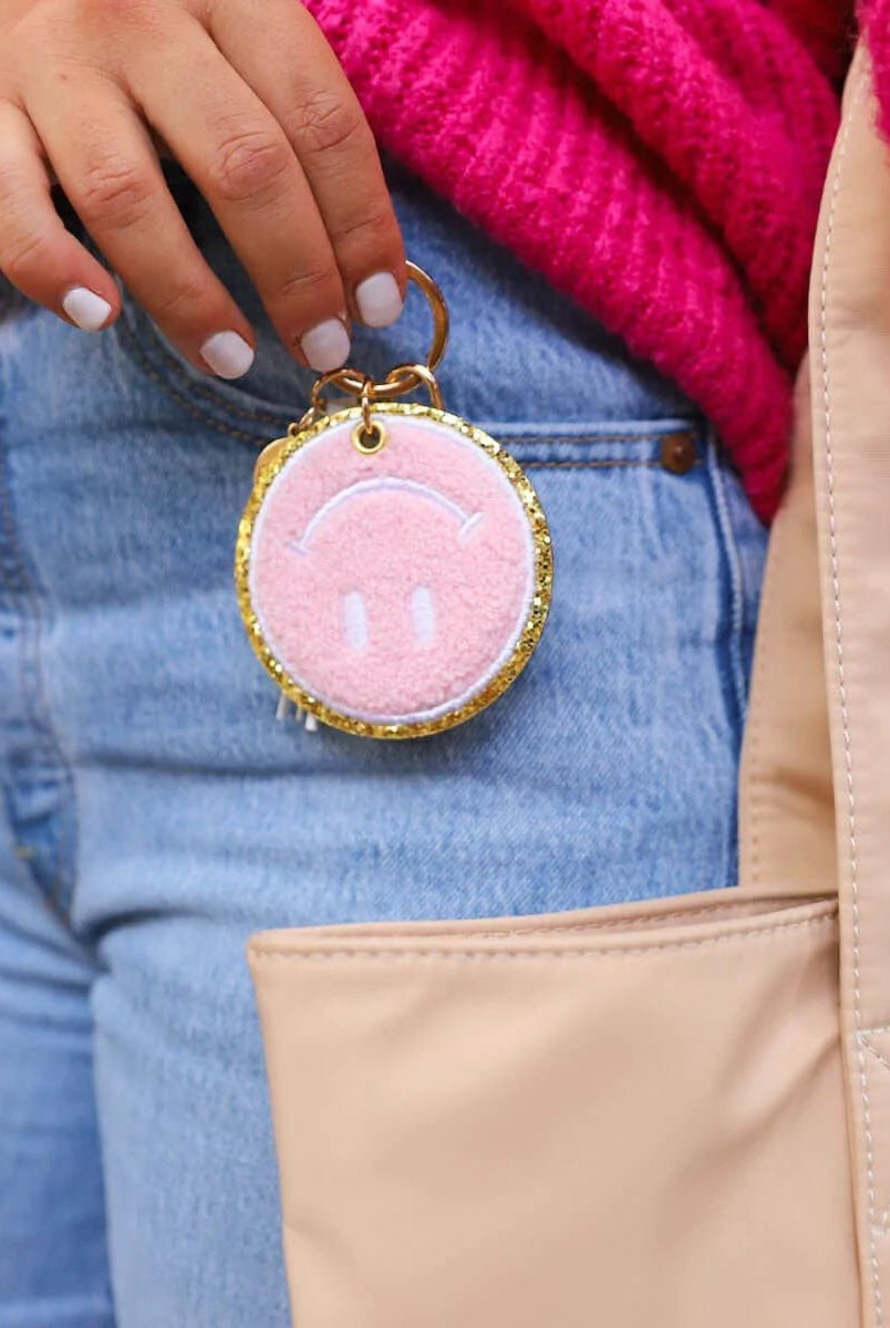 Packed Party Keep Cozy Smiley Keychain by Packed Party – Keyring – Pink | Spoiled Brat UK