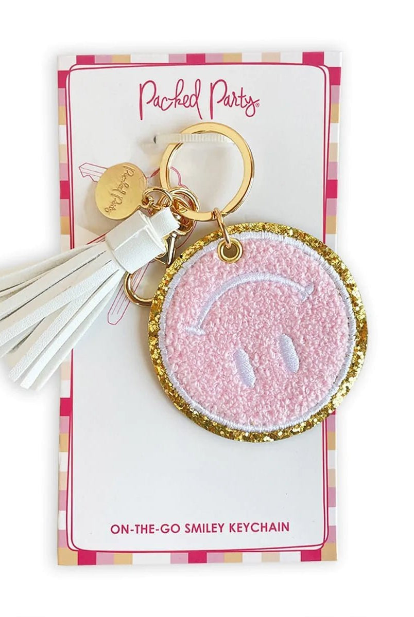 Packed Party Keep Cozy Smiley Keychain by Packed Party – Keyring – Pink | Spoiled Brat UK