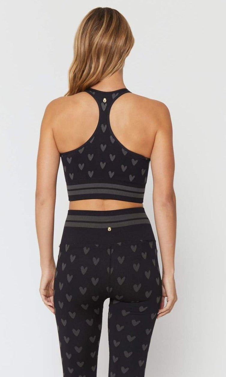 Shop Spiritual Gangster Spiritual Gangster High Neck Jacquard Seamless Black Sports Bra as seen on Miranda Cosgrove Vest Top for women – premium loungewear and festival fashion at Spoiled Brat