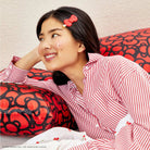 Hello Kitty x Kitsch Satin Pillowcase - Hello Kitty Bathes in a Sea of Bows Pillow by Kitsch as seen on celebrities
