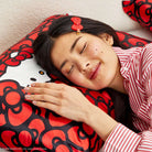 Hello Kitty x Kitsch Satin Pillowcase - Hello Kitty Bathes in a Sea of Bows Pillow by Kitsch as seen on celebrities