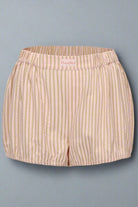 Beige striped shorts on a light gray background