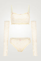 Cream-colored bikini set on a light gray background