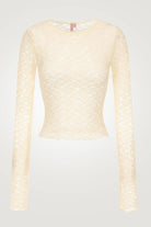 Light yellow textured long-sleeve top on a light gray background