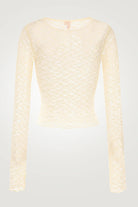 Light yellow textured cardigan on a light gray background