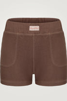 Brown shorts with a visible brand label on a light gray background