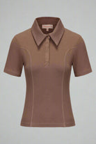 Brown polo shirt on a light gray background