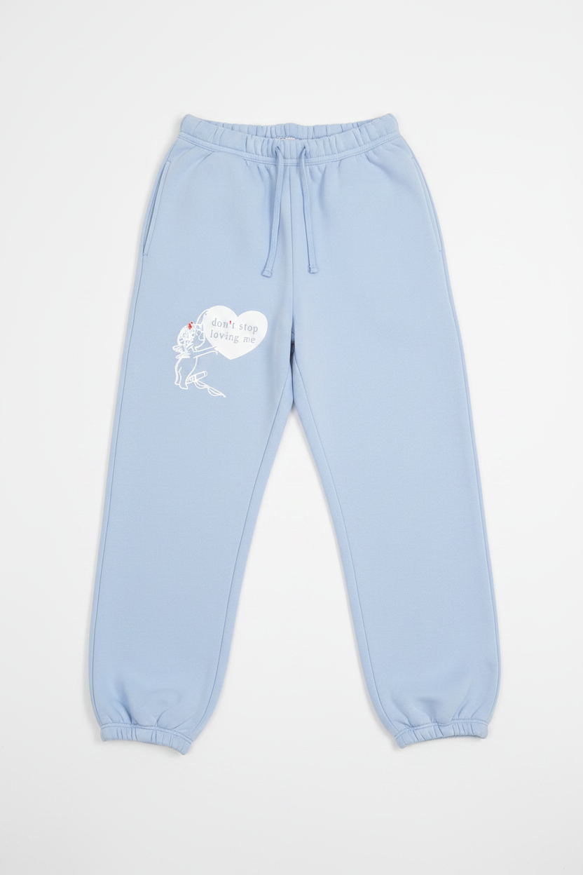 Light blue boys lie sweatpants with a heart design on a white background