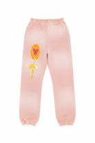 Pink BOYS LIE sweatpants with a heart-shaped balloon design on a white background