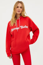 Shop Beach Riot Beach Riot Alissa Santa Babe Hooded Sweater as seen on Una Healy Sweater for women – premium loungewear and festival fashion at Spoiled Brat